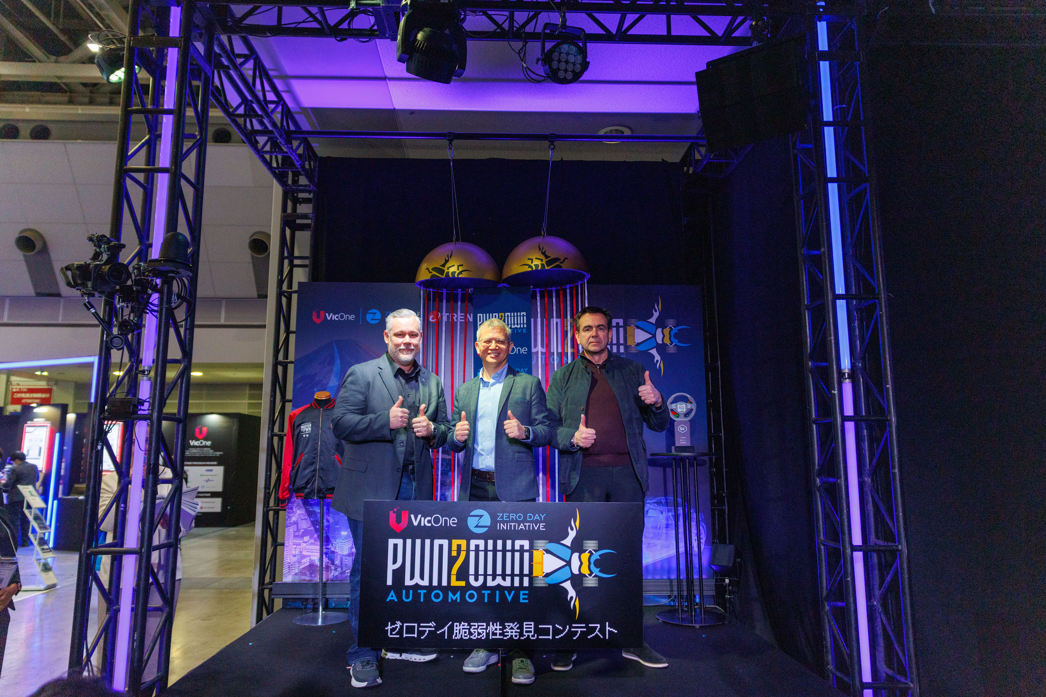 Figure 1. Brian Gorenc, Vice President of Threat Research at TrendAI, Max Cheng, CEO of VicOne, and Adam Laurie, Chief Information/Product Security Officer of Alpitronic, during the opening ceremonies of Pwn2Own Automotive 2026